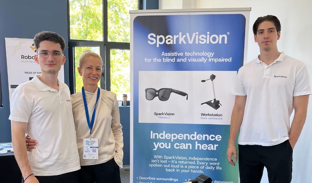 Part of the SparkVision team in front of the stand with the Glasses 2 and Workstation products at Robotics Strategy Forum 2026