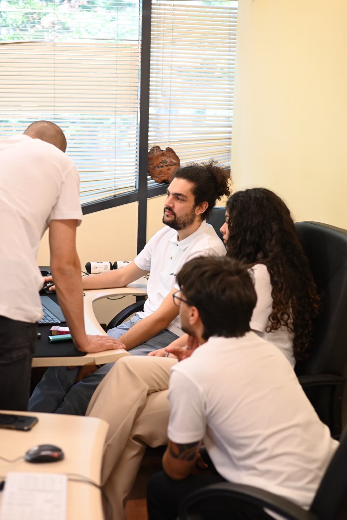 SparkVision team members reviewing product software together.